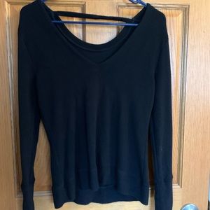 Black long sleeve shirt with open back detail